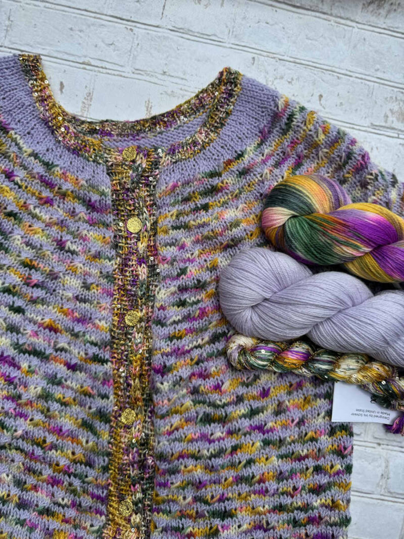 Flowers of Henderson Canyon Cardi shown with yarns.